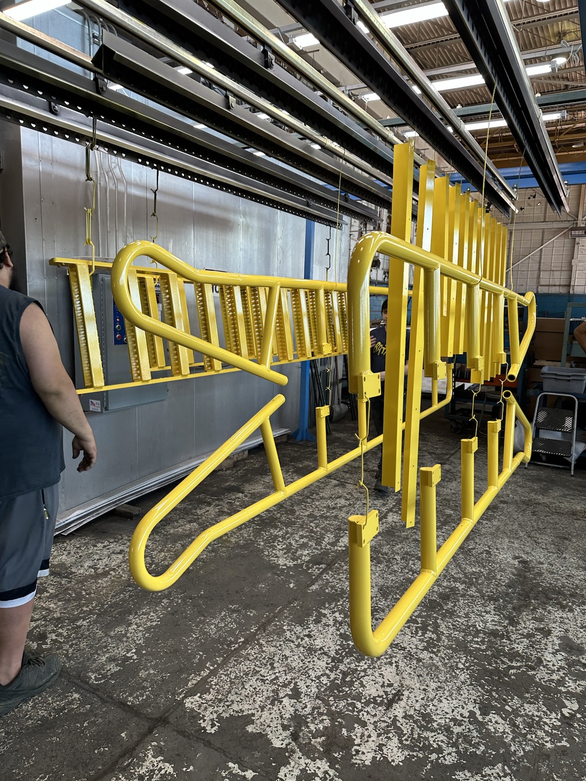 Yellow powder coated aerospace guardrails
